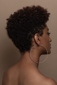 Backview of a woman rocking a v lowcut.